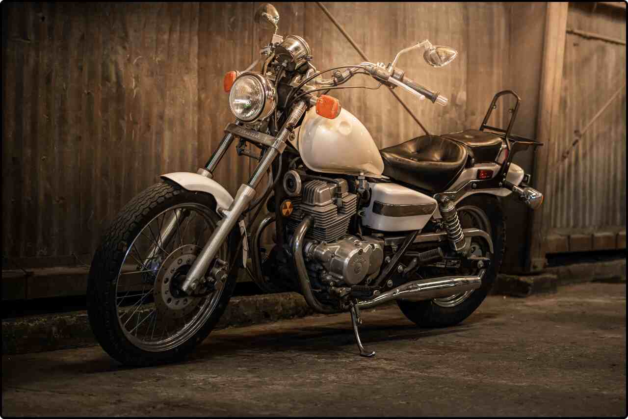 Modern cruiser bike with a black and silver design parked outdoors.